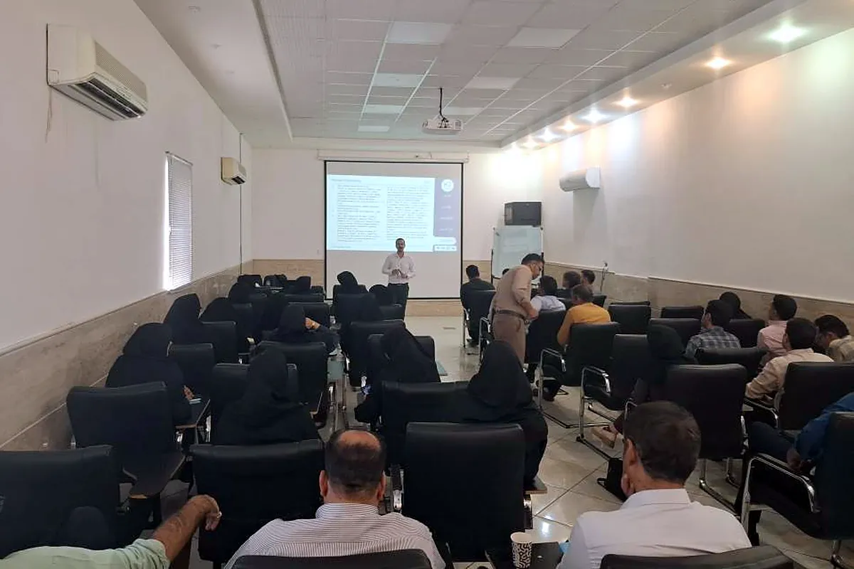 Keivan Jamali presenting to a full classroom during a Prompt Engineering workshop